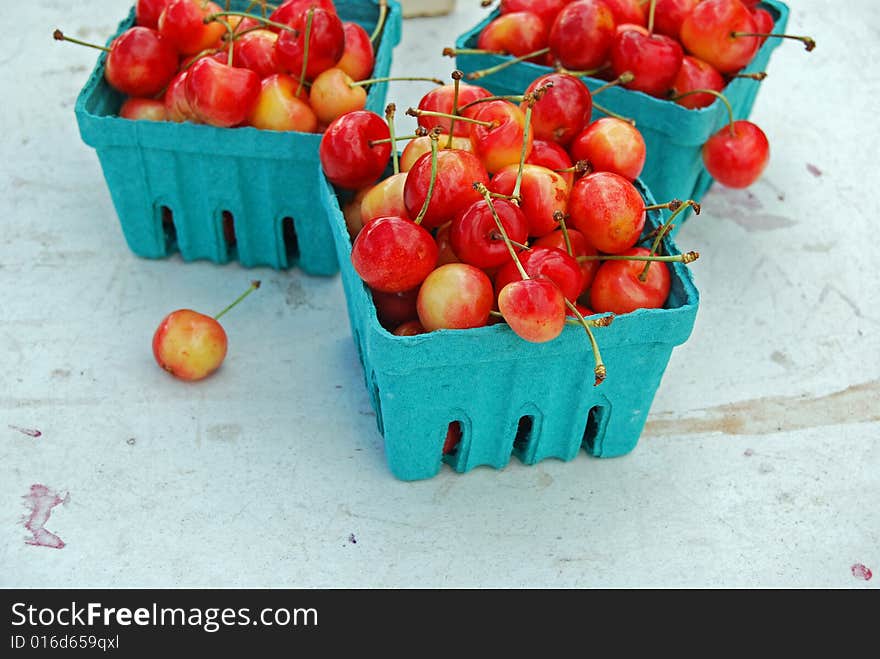 Cherries in disposable boxes at the farmer's market. Cherries in disposable boxes at the farmer's market.