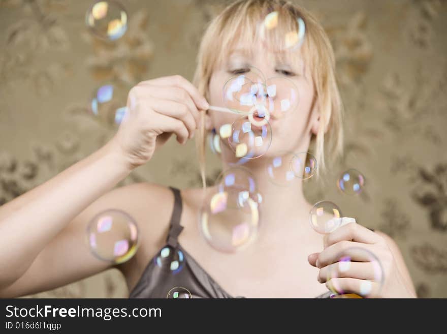 Pretty young girl blowing bubbles