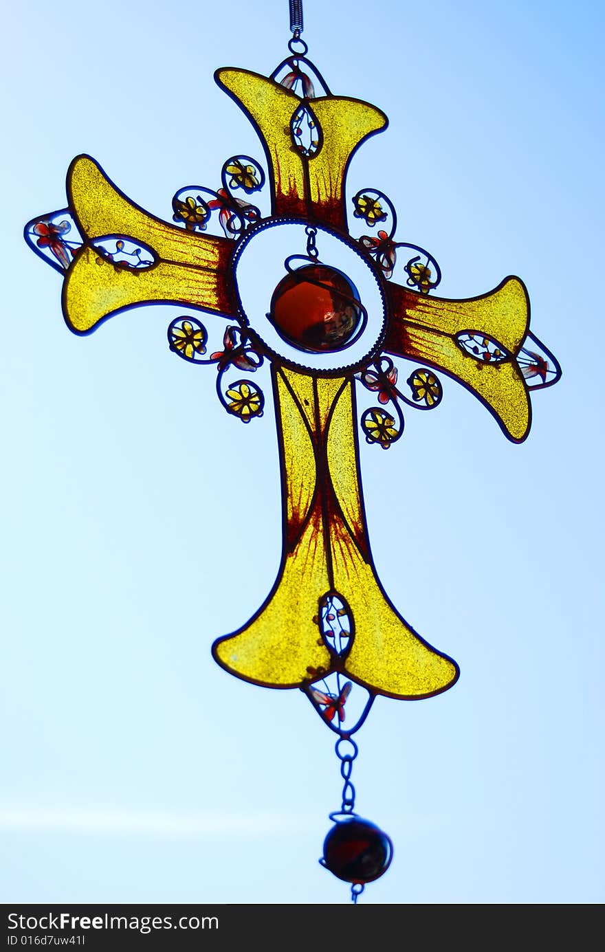 Cross - metal and  yellow glass. Cross - metal and  yellow glass