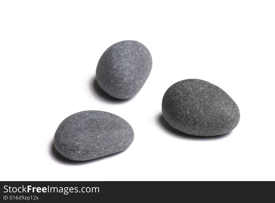 Three smooth stones on white background. Three smooth stones on white background