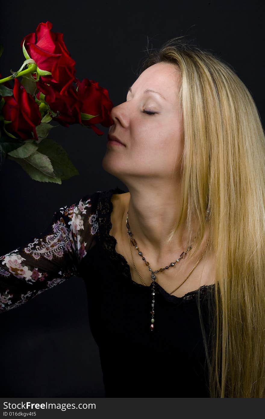 Long hair blonde woman with bunch of flowers. Long hair blonde woman with bunch of flowers