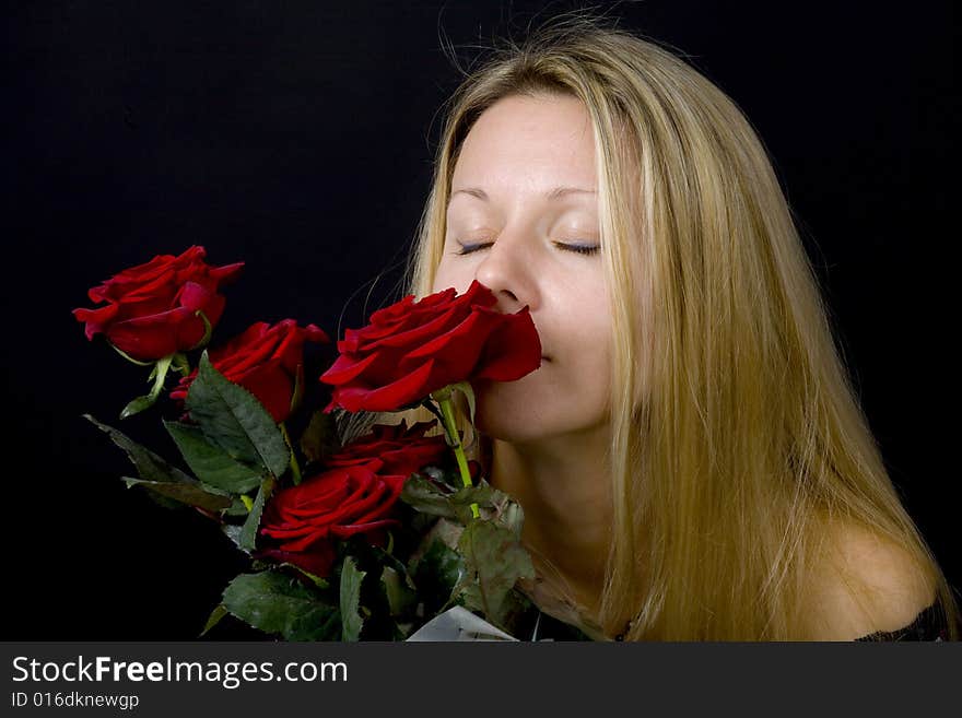 Long hair blonde woman with bunch of flowers. Long hair blonde woman with bunch of flowers