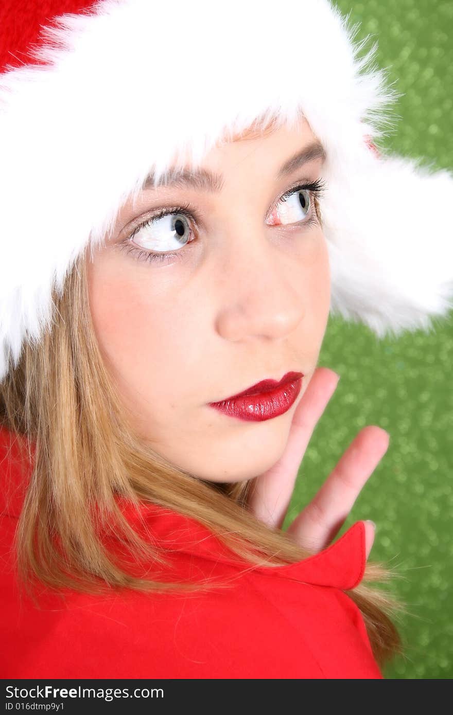 Teenager with red lips wearing a christmas hat. Teenager with red lips wearing a christmas hat