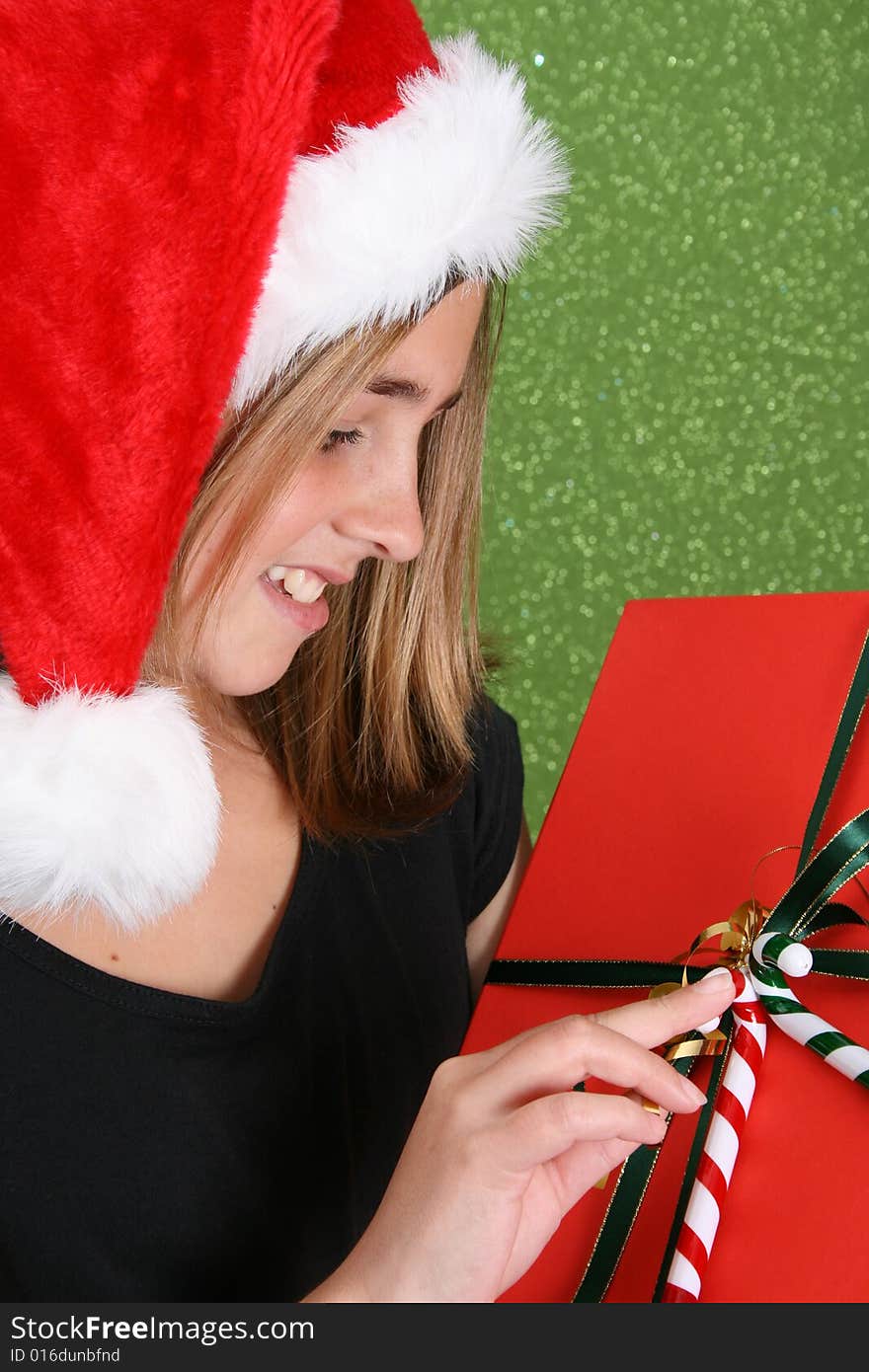 Beautiful teenager girl wearing a christmas hat. Beautiful teenager girl wearing a christmas hat