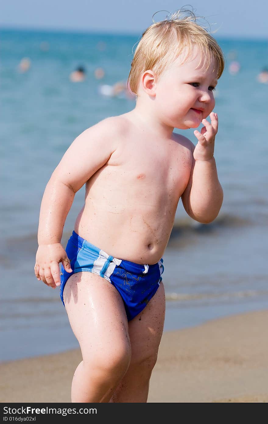 Portrait of the child on a background of the sea