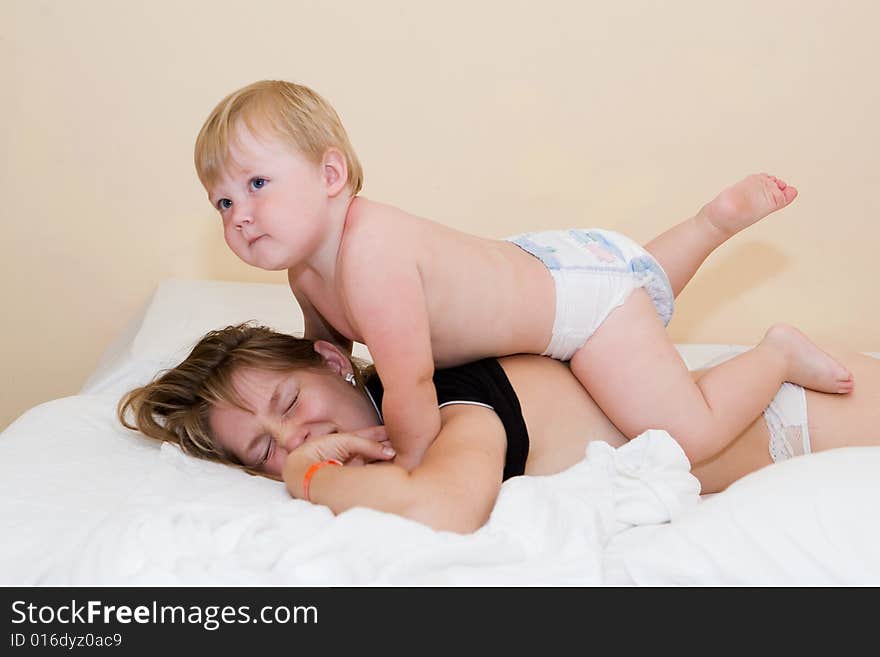 Small child does massage to mum