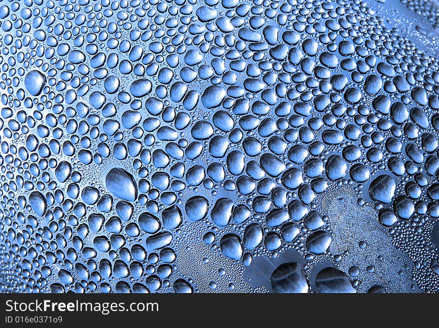 Water drops on a bottle closeup