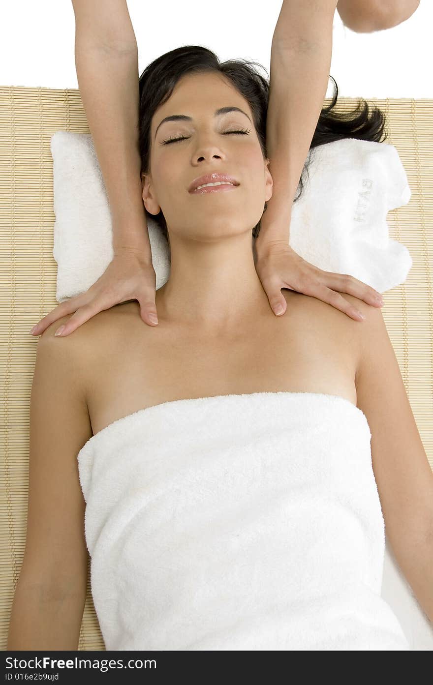 White woman receiving massage on an isolated background