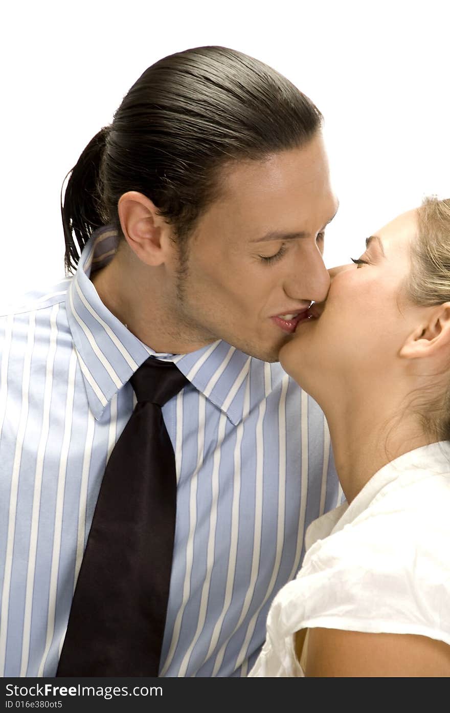 Kissing couple posing with white background