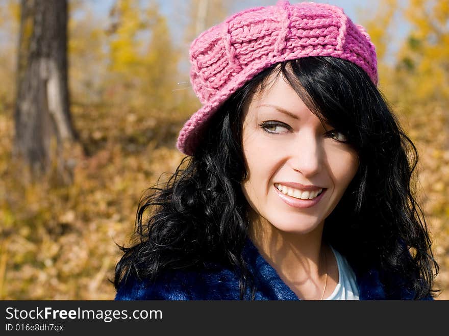 Beautiful Brunette Woman In The Park