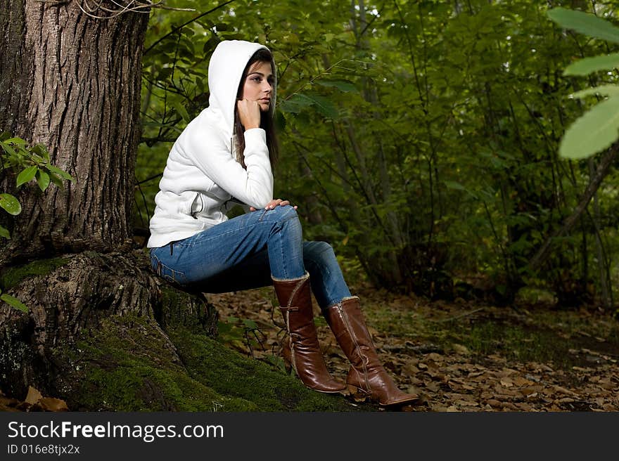 Young woman on autumn forest under chestnut tree. Young woman on autumn forest under chestnut tree