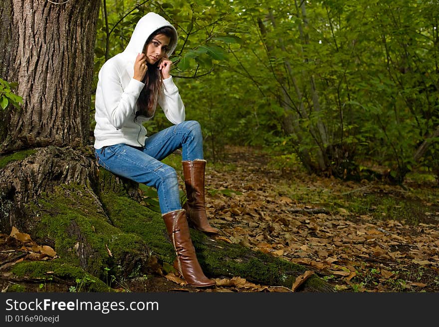 Young woman on autumn forest under chestnut tree. Young woman on autumn forest under chestnut tree