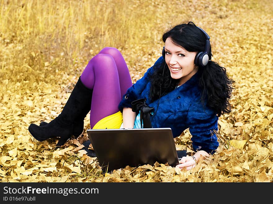 Pretty girl with a laptop outdoor