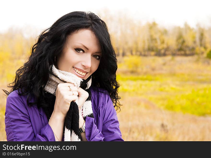 Happy beautiful brunette girl in the park. Happy beautiful brunette girl in the park