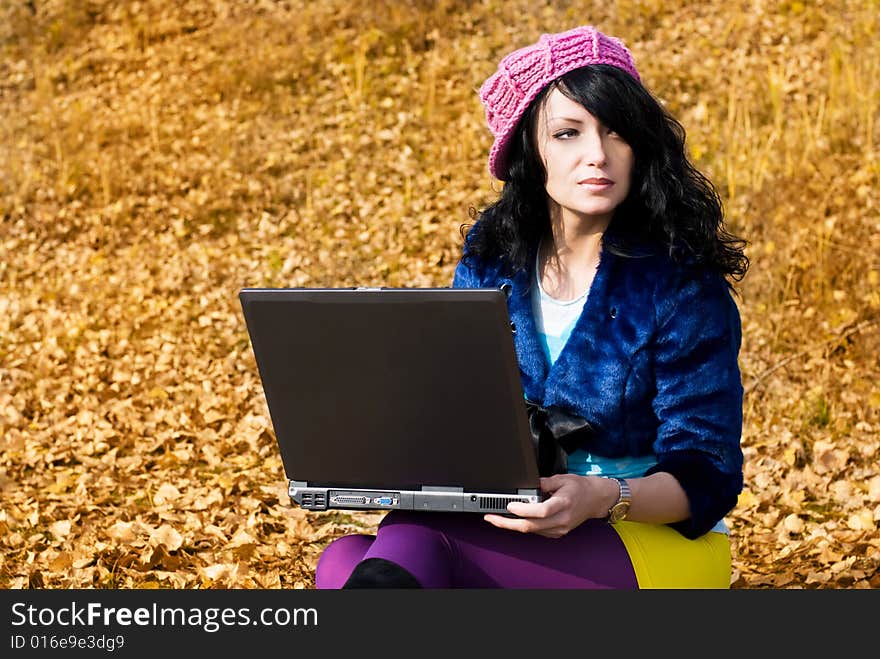 Dreamy Girl With A Laptop Outdoor