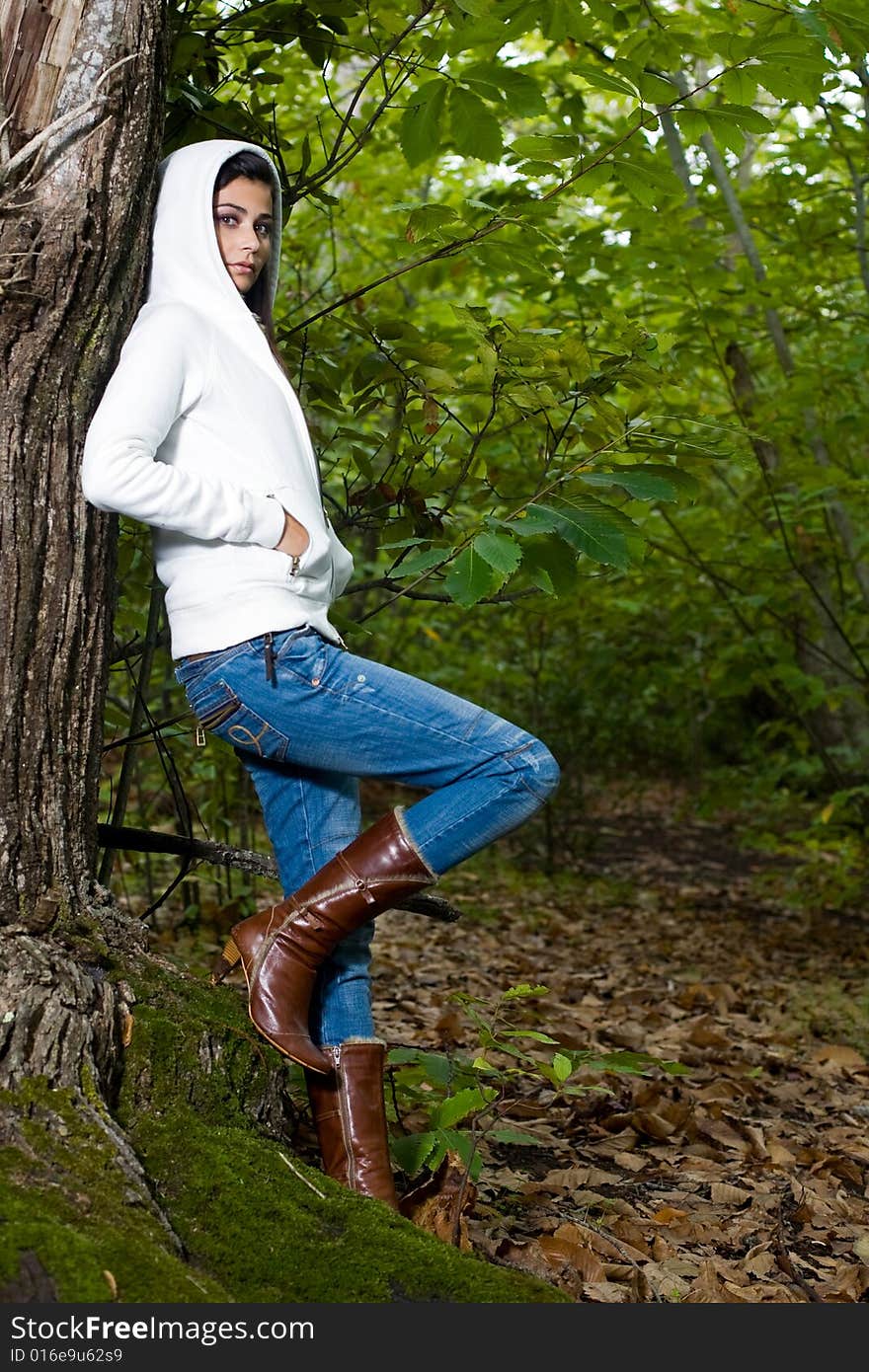 Young woman on autumn forest under chestnut tree. Young woman on autumn forest under chestnut tree