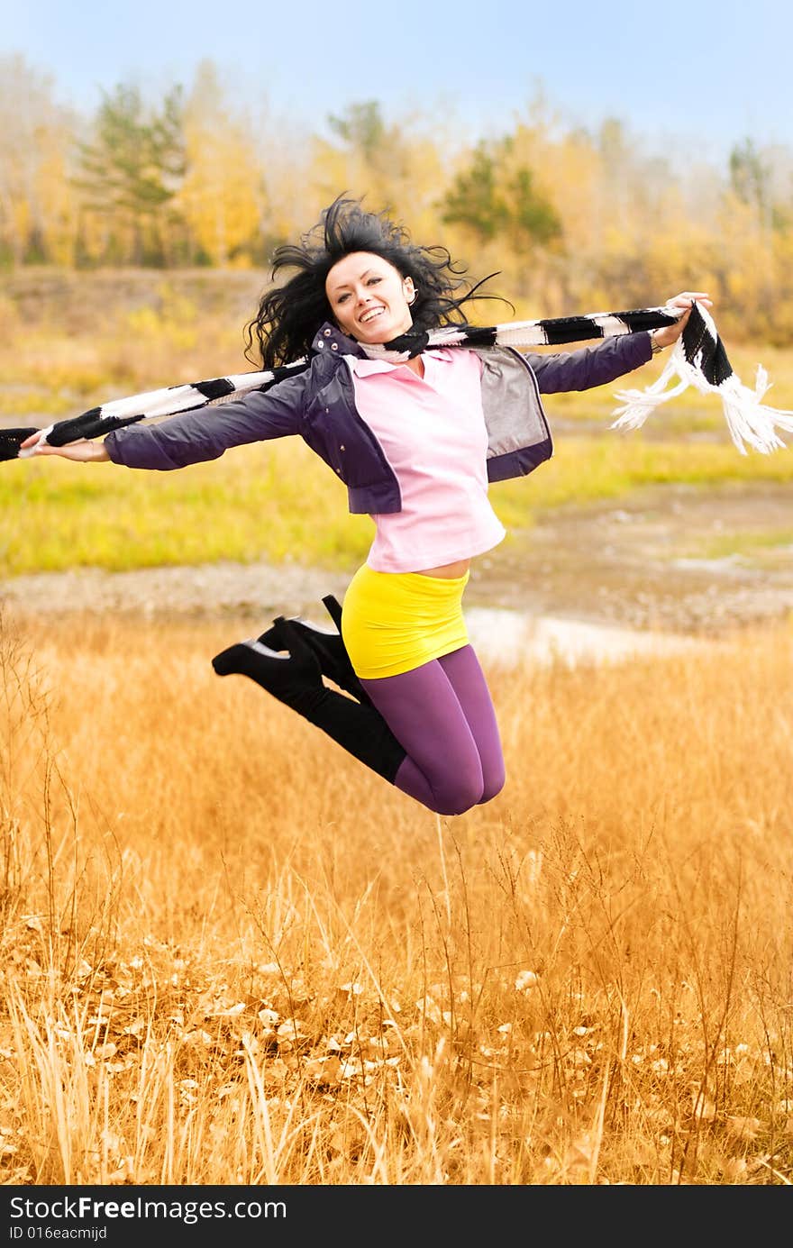 Happy beautiful jumping girl outdoor. Happy beautiful jumping girl outdoor