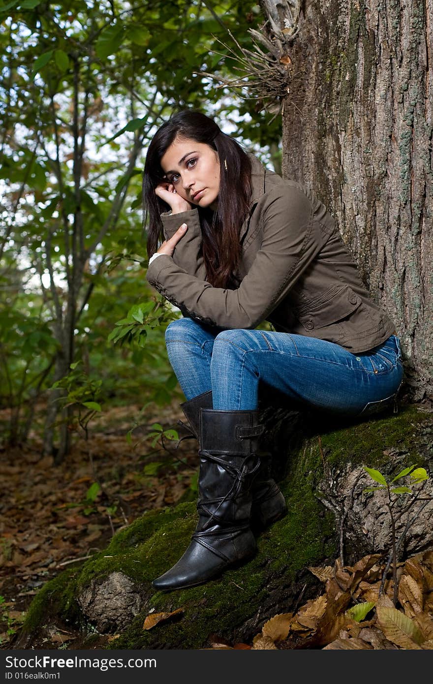 Young woman on autumn forest under chestnut tree. Young woman on autumn forest under chestnut tree