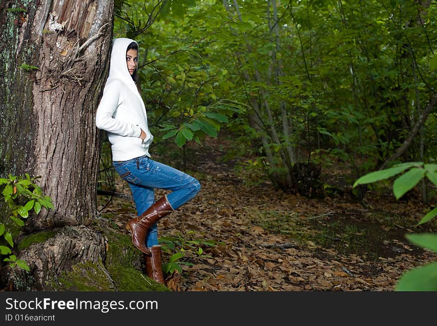 Young woman on autumn forest under chestnut tree. Young woman on autumn forest under chestnut tree