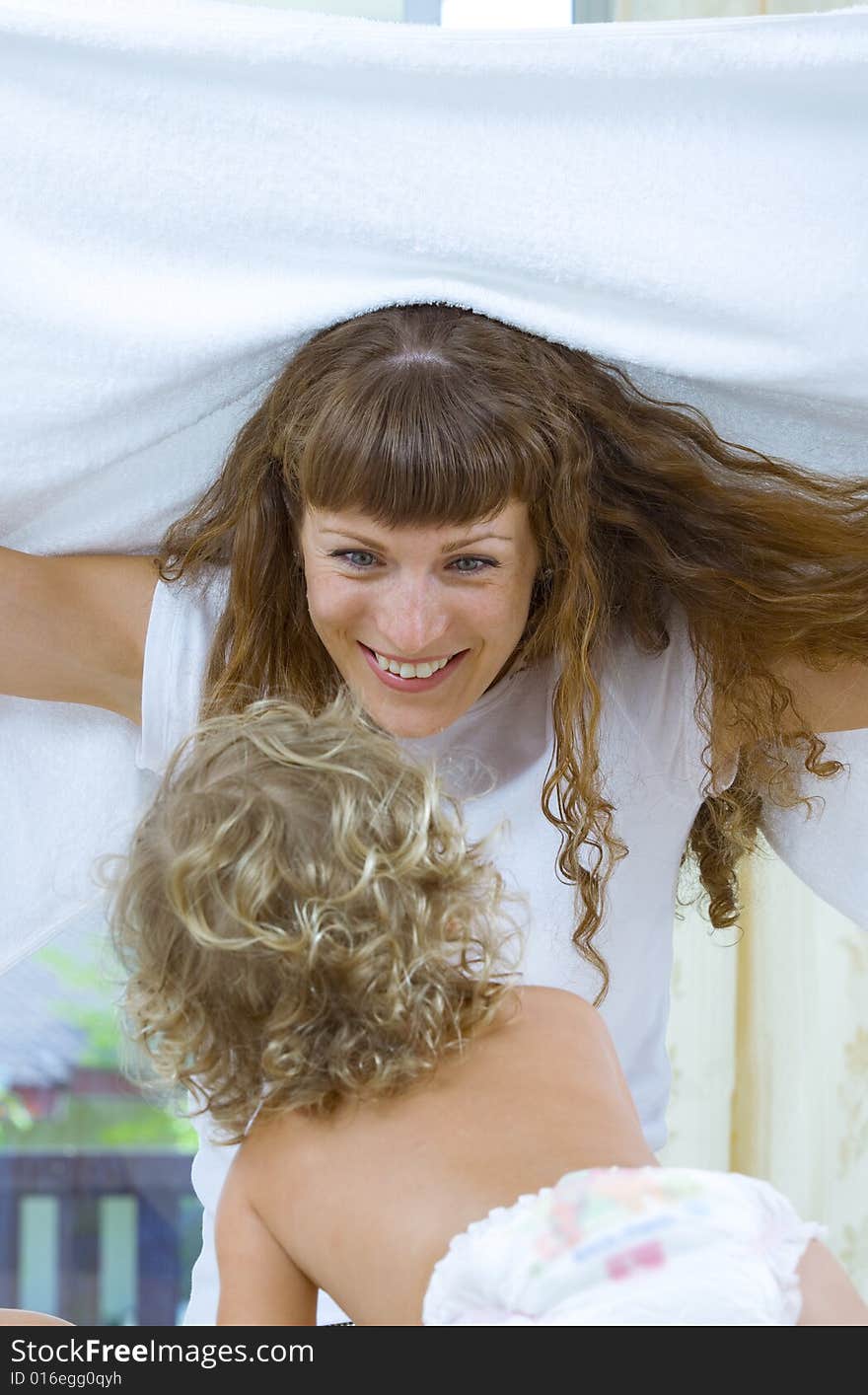 High key portrait of happy mother with baby. High key portrait of happy mother with baby