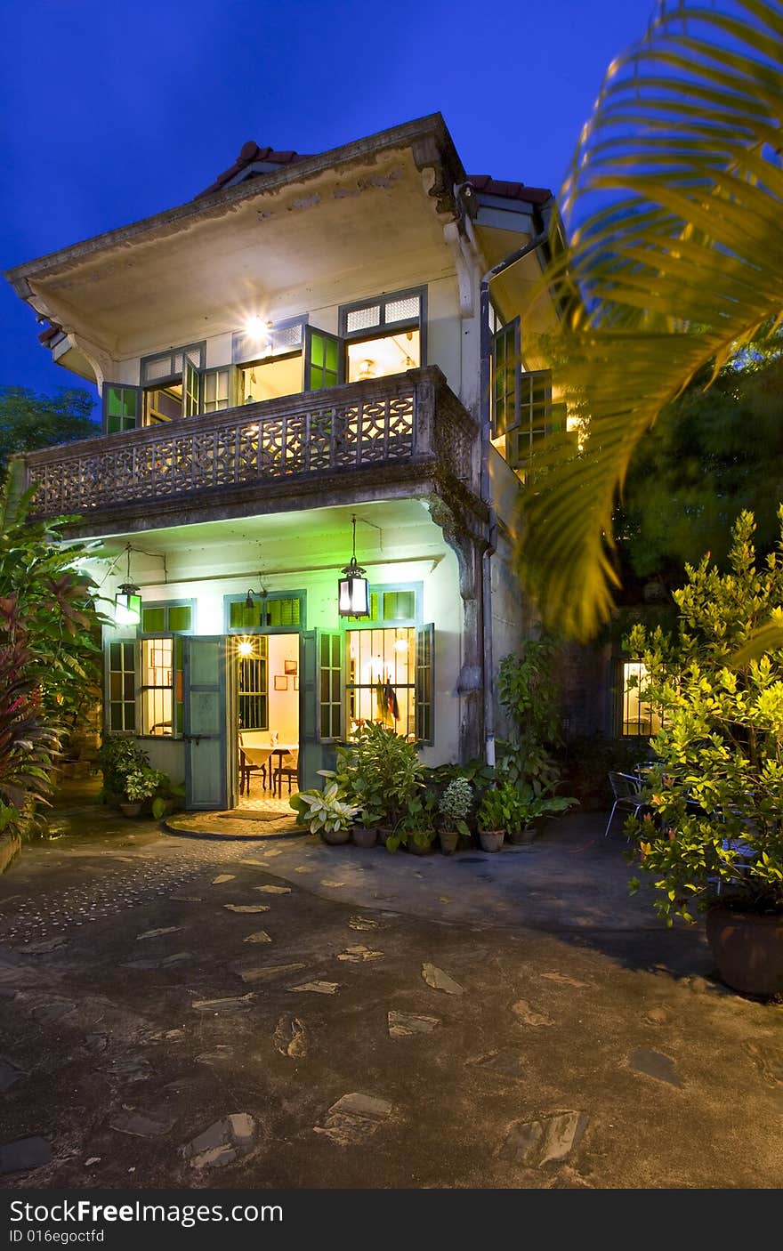 Panoramic view of small tropic Chinese restaurant during dusk. Panoramic view of small tropic Chinese restaurant during dusk