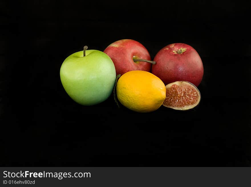 Mixed fruits isolated on black background