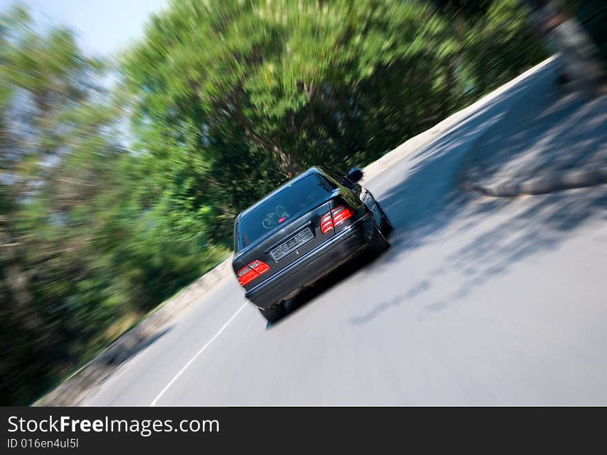 The car on big speed drives in turn. The car on big speed drives in turn