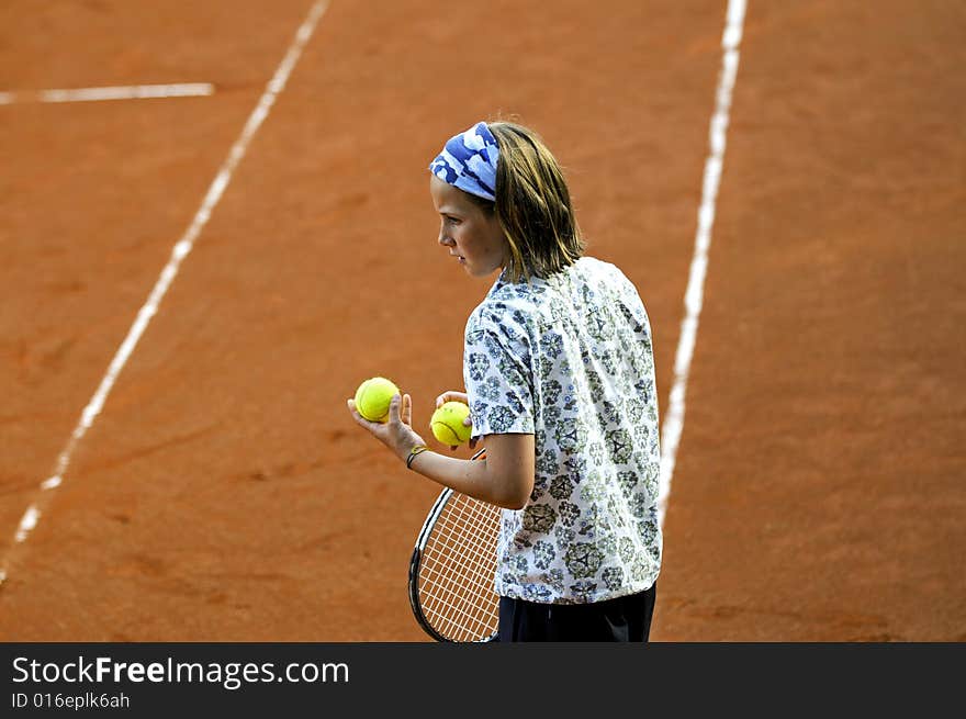 Outdoor portrait of girl holding tennis balls. Outdoor portrait of girl holding tennis balls