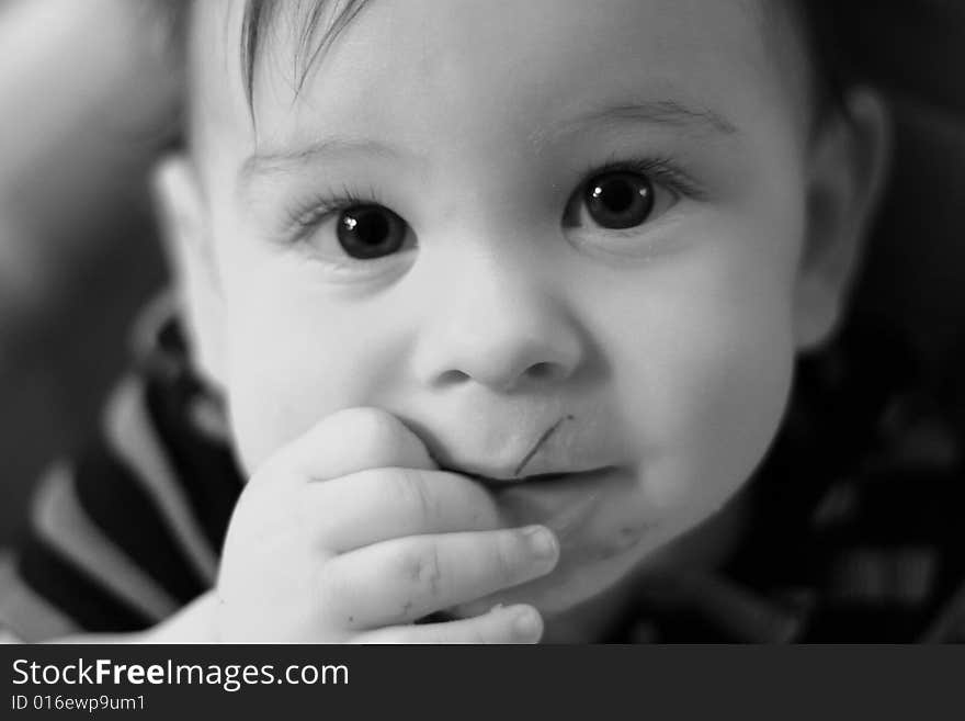 Young boy with big eyes looking up