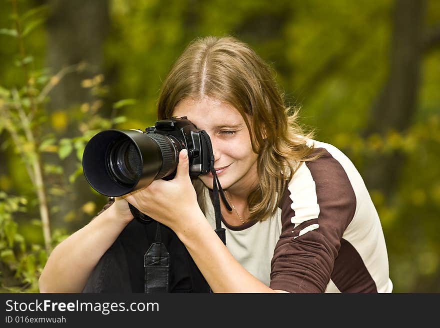 Photographer In Autumn Forest