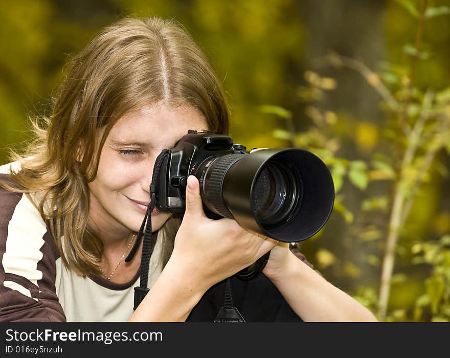 Photographer in autumn forest