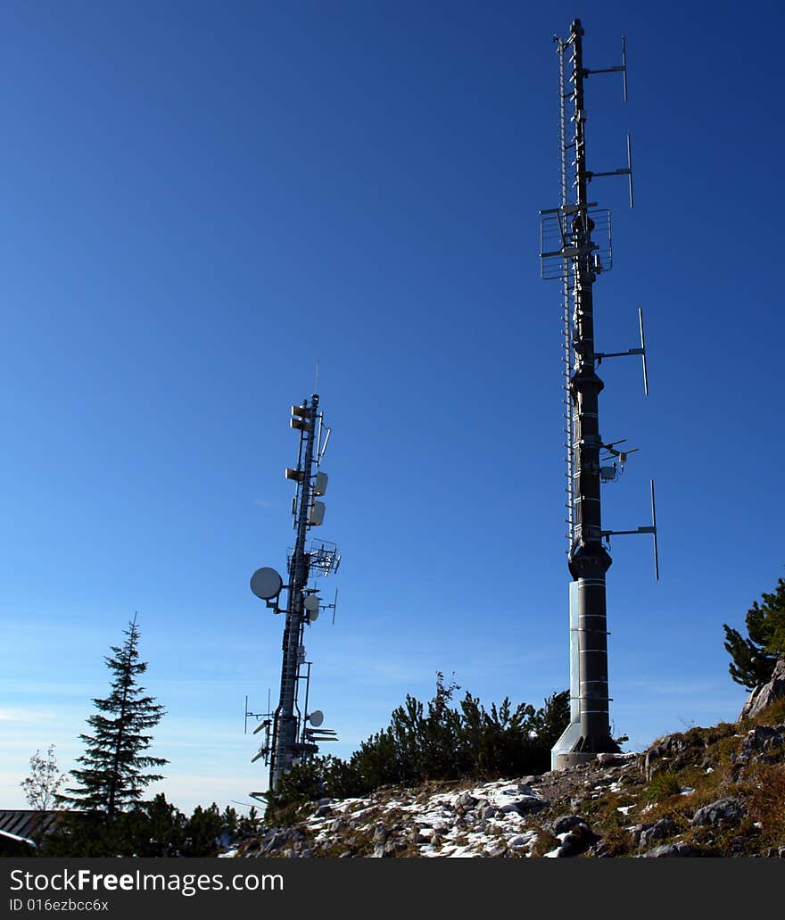 Anthenne Masts with sattelite Dishes on the peak of Mountain. Anthenne Masts with sattelite Dishes on the peak of Mountain.