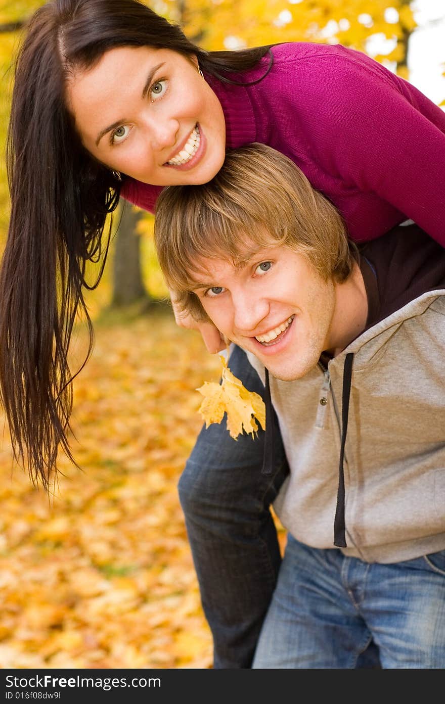 Happy couple outdoors in autumn park