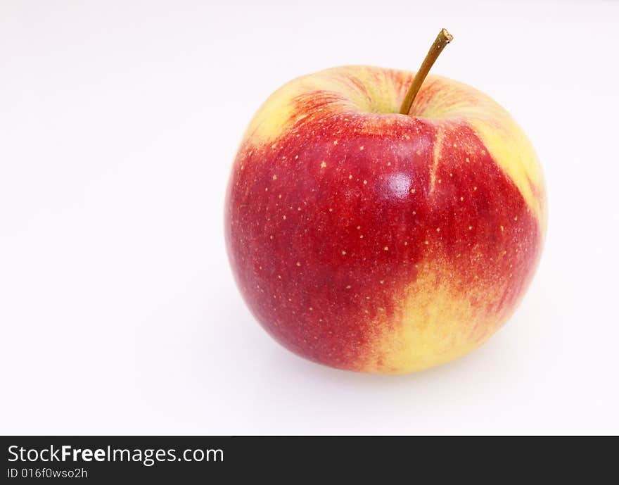 Single fresh red yellow apple