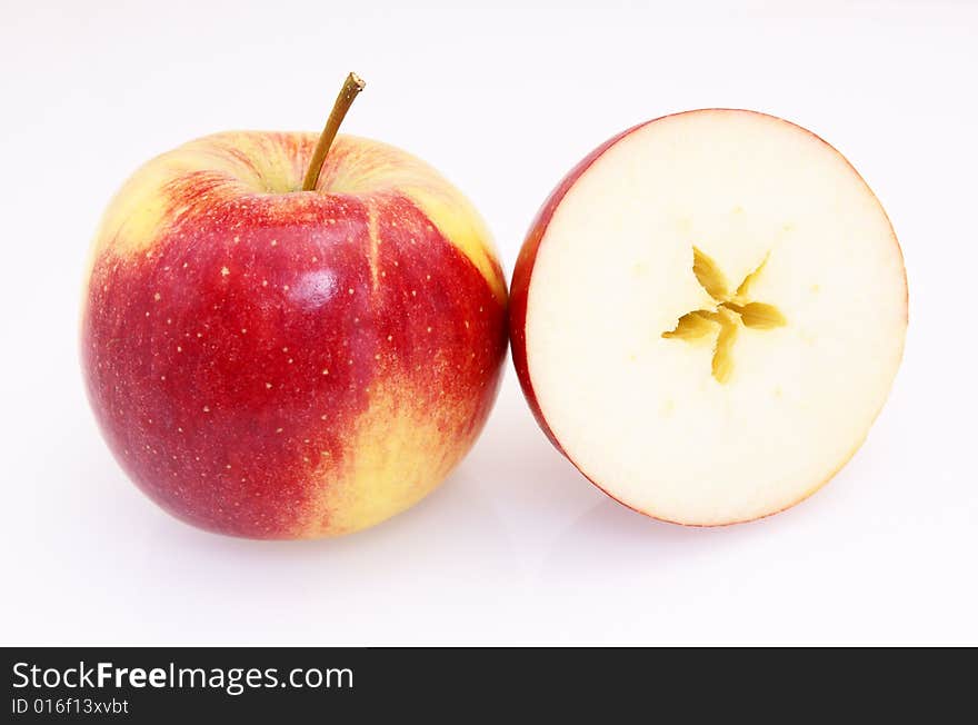 One and half red yellow fresh apple