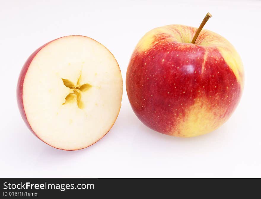 One and half red yellow fresh apple