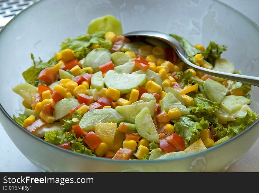 Photo of very tasty salad with spoon