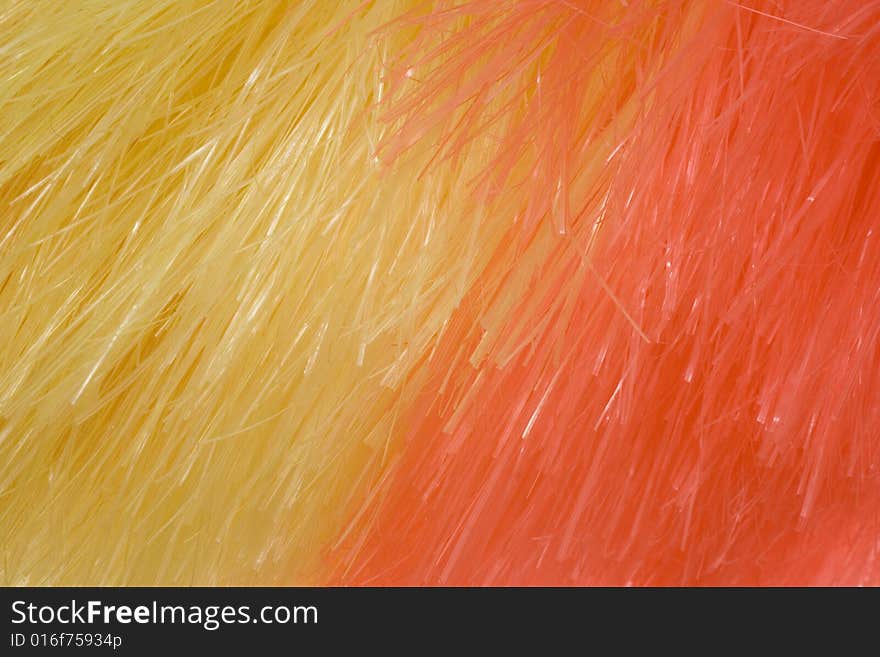 Yellow and red background of artificial fibres