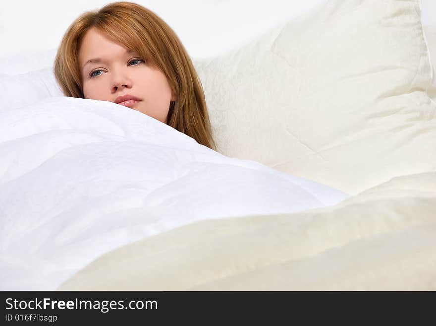 Girl Resting In Soft Luxury Bed