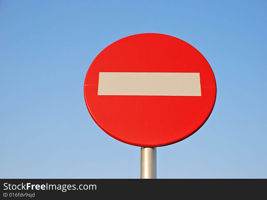 No entry sign against blue sky