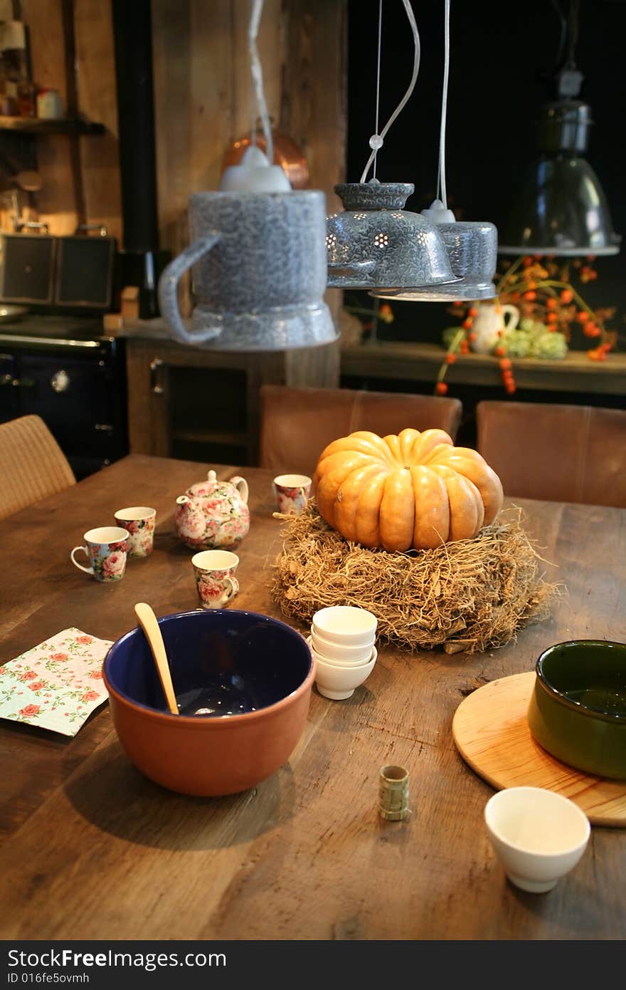 Table with pumpkin in country kitchen. Table with pumpkin in country kitchen