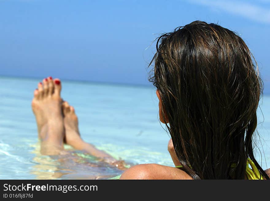 Girl Lying In Ocean