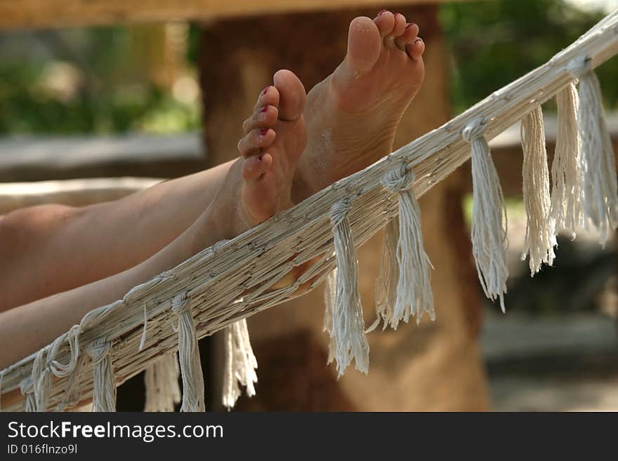 Female feet on hammock