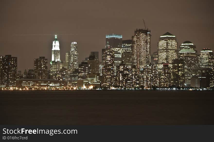 A city scape of Manhattan at night time,  this is the view from Jersey City- from across the river. A city scape of Manhattan at night time,  this is the view from Jersey City- from across the river