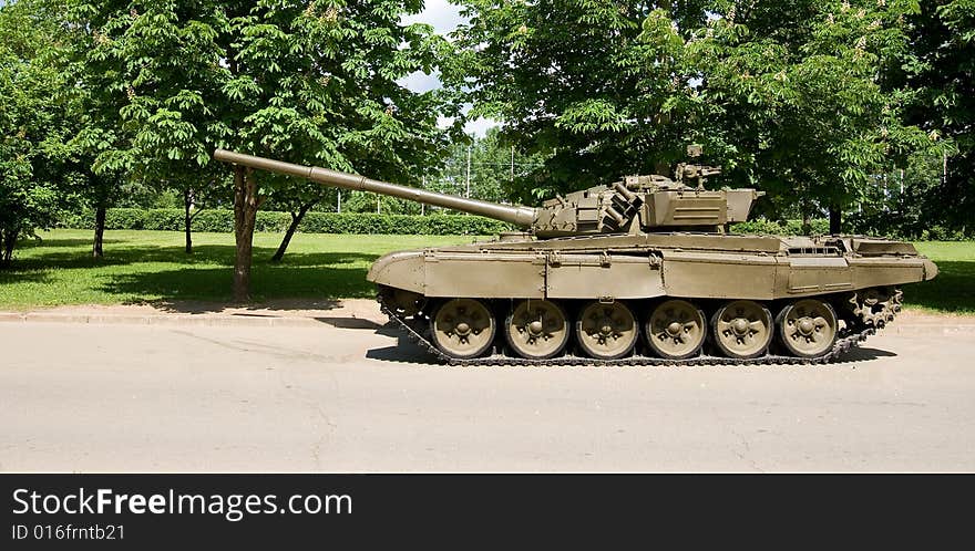 A view of a modern armor parked in a park. A view of a modern armor parked in a park