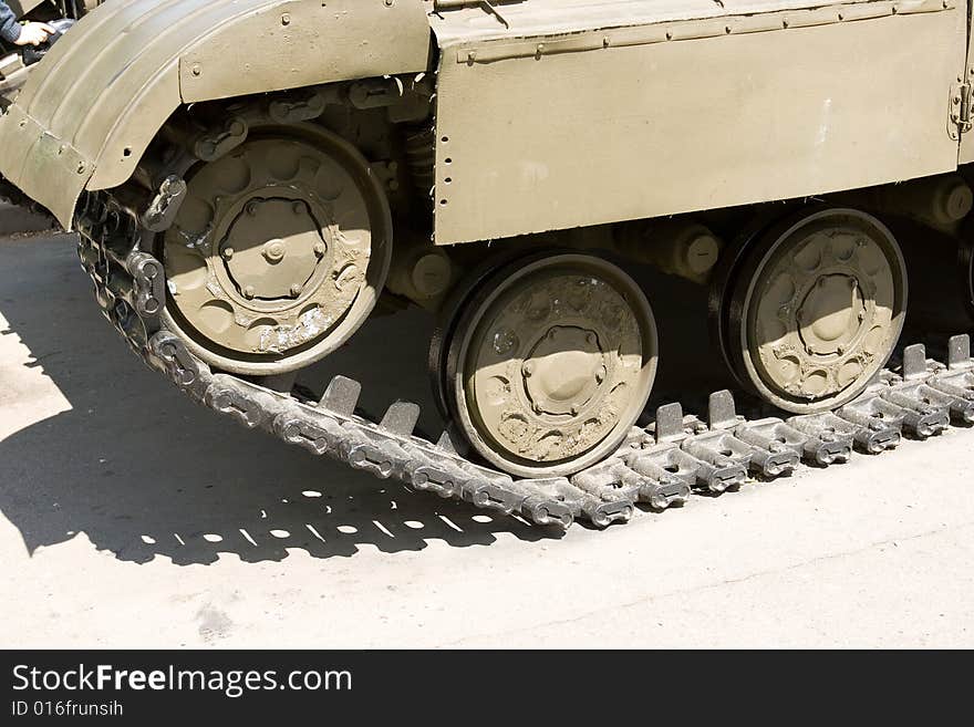 A closeup of tracks of an old military vehicle. A closeup of tracks of an old military vehicle