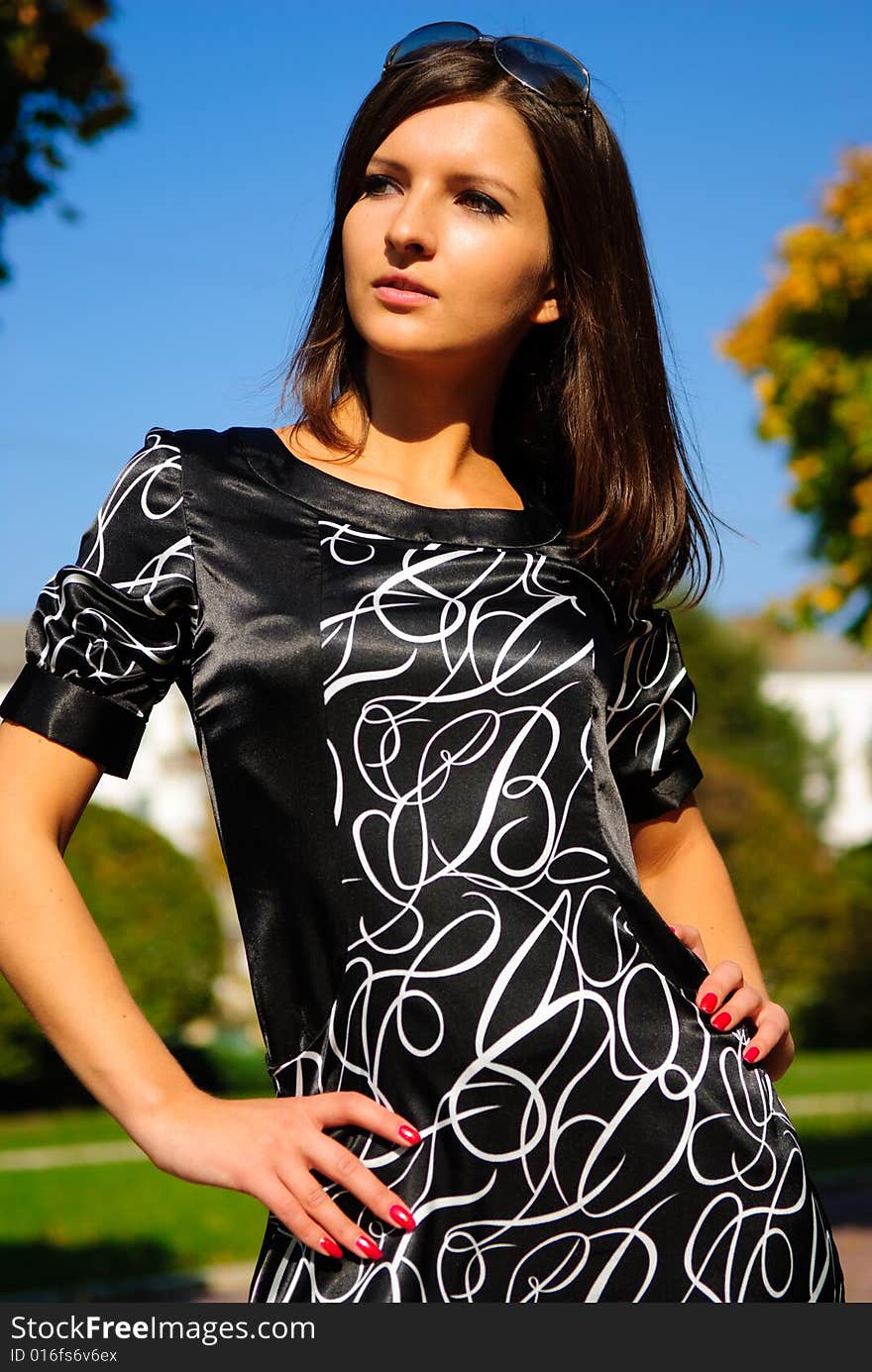 Pretty young girl on a colourful autumn background