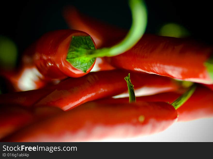 Close up of chillies on a lightening desk. Close up of chillies on a lightening desk