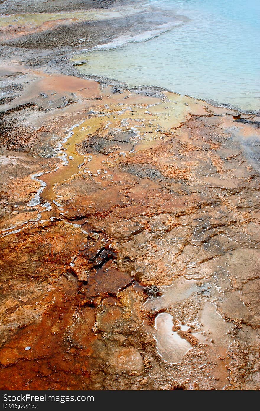 Colorful rock by geyser