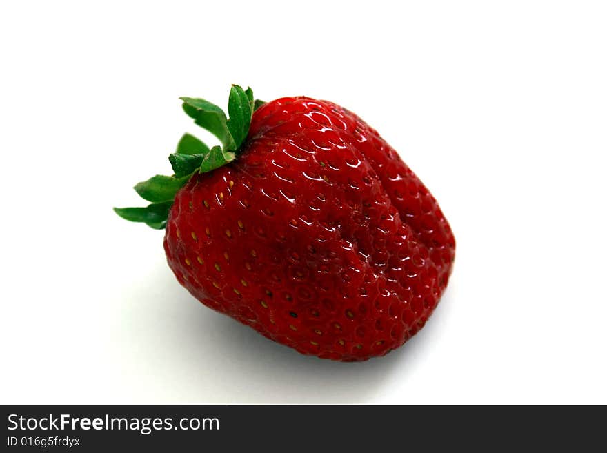 A fresh local organic strawberry. A fresh local organic strawberry